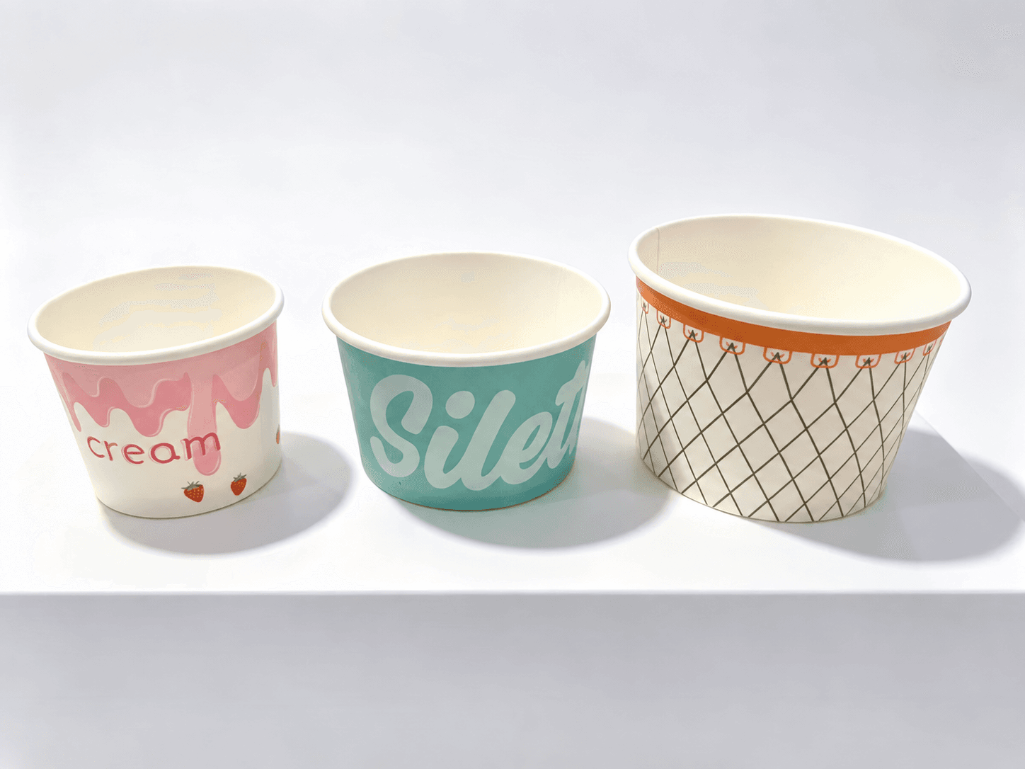 Three ice cream cups shown together in an AI-assisted design reference