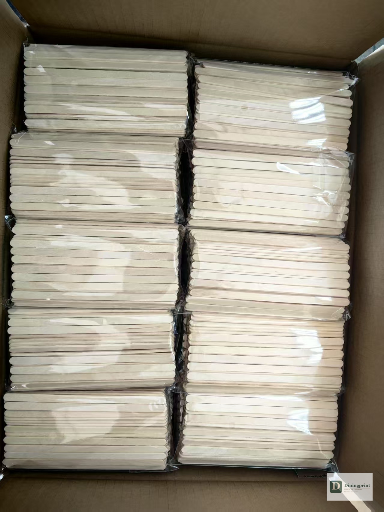 Carton of unprinted birchwood disposable chopstick blanks ready to be fed into the production line